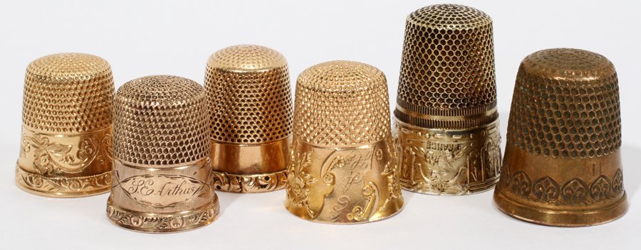 AMERICAN & FRENCH YELLOW GOLD & BRASS THIMBLES,: AMERICAN & FRENCH YELLOW GOLD & BRASS THIMBLES, 19TH & 20TH CENTURY, SIX, H 1":Including 2 thimbles by Ketcham & McDougall stamped "14K", totaling approximately 10 grams; 1 10 kt yellow gold thimble b