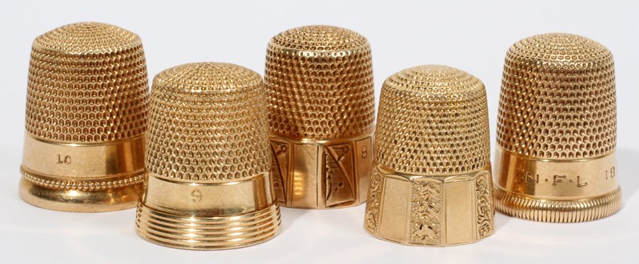 AMERICAN 14 KT Y/GOLD THIMBLES 19TH-20TH C.: AMERICAN 14 KT YELLOW GOLD THIMBLES, 19TH & 20TH CENTURY, FIVE, H 1":All are stamped "14K" and are by Ketchum & McDougall and Simons Bros.. Totaling approximately 23 grams.