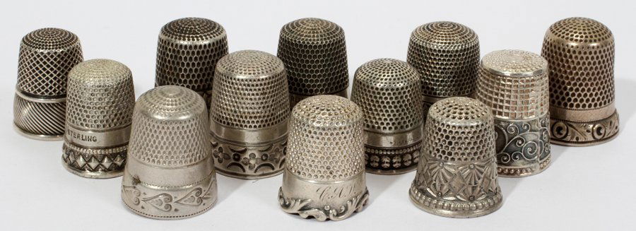 AMERICAN STERLING & SILVER THIMBLES, C. 1900: AMERICAN STERLING & SILVER THIMBLES, C. 1900, TWELVE, H 1":9 are stamped "Sterling" and include a variety of makers such as Sterns Bros., Ketcham & McDougall and Simons Bros., totaling approximately 1