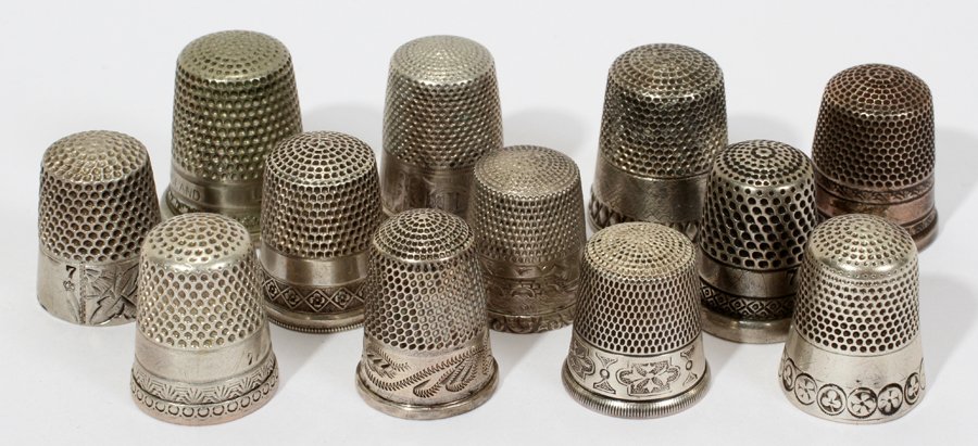 AMERICAN & ENGLISH STERLING & SILVER THIMBLES,: AMERICAN & ENGLISH STERLING & SILVER THIMBLES, ANTIQUE, TWELVE, H 1":Only 4 are stamped "Sterling", which total approximately 0.45 trz, two of which are by Waite, Thresher & Co. and two are by Simons 