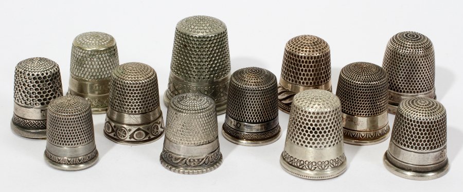 AMER. & CONTINENTAL STERLING & SILVER THIMBLES: AMERICAN & CONTINENTAL STERLING & SILVER THIMBLES, ANTIQUE, TWELVE, H 3/4" - 1":The sterling thimbles include such makers as Ketcham & McDougall, Waite & Thresher Co., Simons Bros. and Henry Griffith 