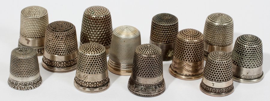 AMERICAN & ENGLISH STERLING & SILVER THIMBLES: AMERICAN & ENGLISH STERLING & SILVER THIMBLES, ANTIQUE, TWELVE, H 3/4" - 1":Only 5 are marked either "Sterling" of with the English (Birmingham-stamped with worn maker's initials, an anchor, lion pass