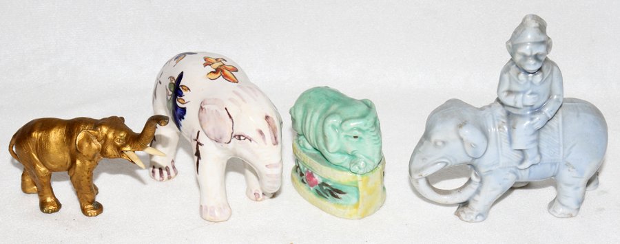 FRENCH FAIENCE ELEPHANT & THREE OTHER FIGURES: FRENCH FAIENCE ELEPHANT & THREE OTHER FIGURES, L 3":Including 1 French Faience elephant, H. 2 1/4", L. 3", signed "Cite.de.Carcassonne", 1 Chinese recumbent elephant, H. 1 3/4", 1 gilt metal with ivor