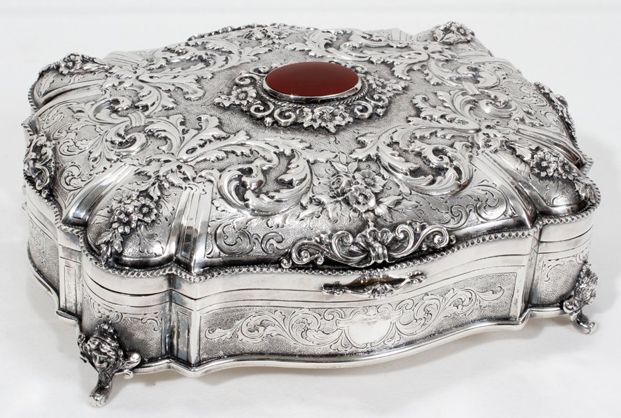 ITALIAN .800 SILVER BOX, 19TH CENTURY, H 3", : ITALIAN .800 SILVER BOX, 19TH CENTURY, H 3", W 8", L 9":Hand chased box with hinged cover is decorated with floral and acanthus leaf motifs and is centered by a carnelian medallion, all ending on four