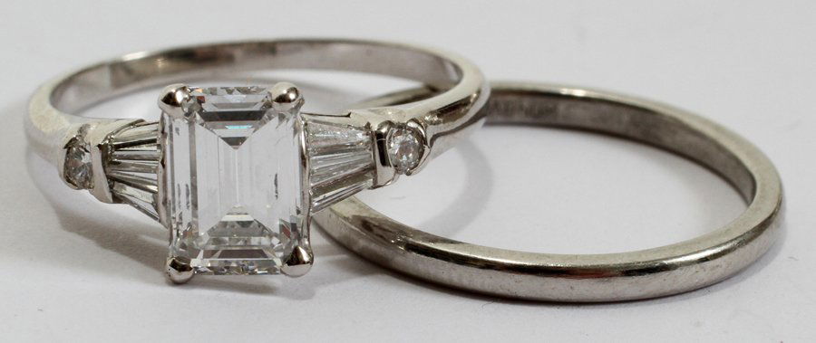 DIAMOND & PLATINUM WEDDING SET, 1.14 CTS, 2 PCS: DIAMOND & PLATINUM WEDDING SET, 1.14 CTS, TWO PIECES:Including 1 engagement ring consisting of an emerald cut center stone, appears to be VVS2 clarity and I color, at 1.14 cts that is flanked by three