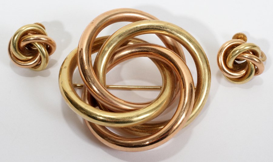 14KT TWO TONE GOLD BROOCH & SCREW BACK EARRINGS: 14 KT TWO TONE GOLD BROOCH & SCREW BACK EARRINGS, PAIR:Rose and yellow gold are intertwined and form a knot type design. Both the pair of earrings and the close on the brooch are stamped "14K". Totali