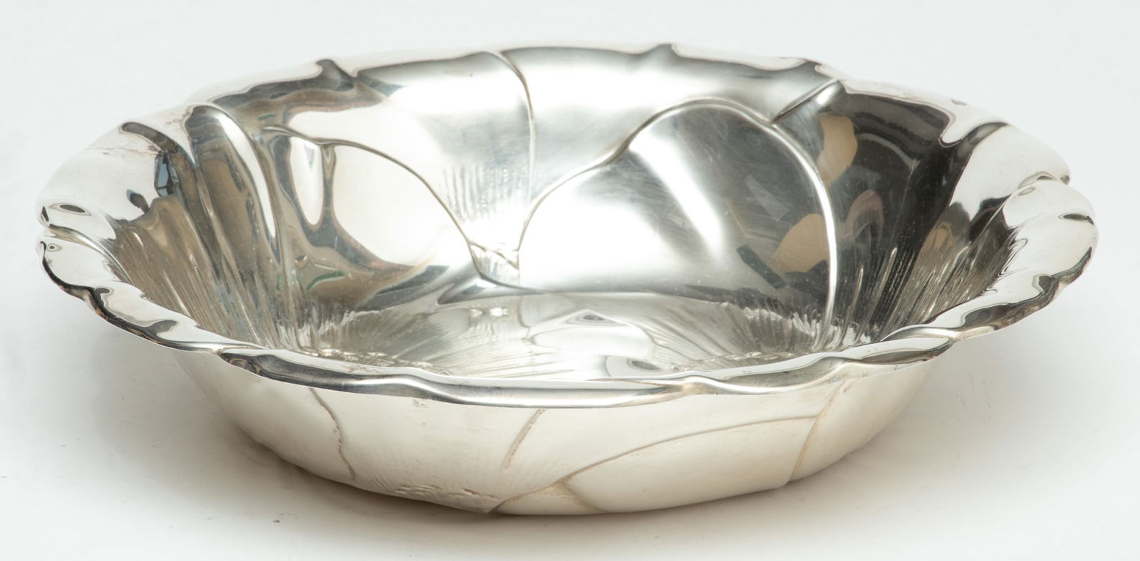 Wallace Silversmiths (American) 'Poppy' Sterling Silver Open Bowl, H 2" Dia. 10" 14.4t oz: Wallace Silversmiths (American) 'Poppy' Sterling Silver Open Bowl, H 2" Dia. 10" 14.4t oz | The bowl offers a flared rim and 'Poppy' pattern motif. Bearing signature branding and hallmarks to the unde