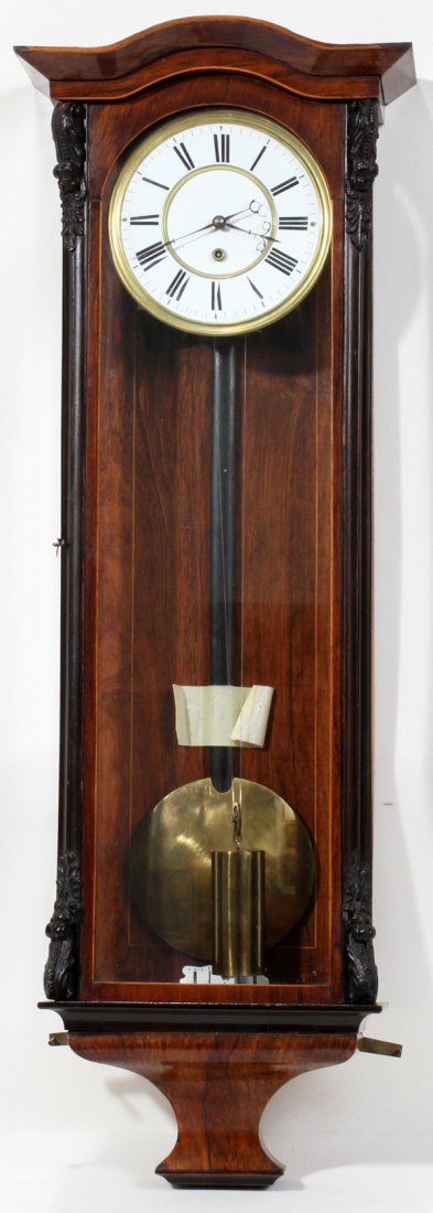 BIEDERMEIER STYLE VIENNA ROSEWOOD 3/4 WALL CLOC: BIEDERMEIER STYLE VIENNA ROSEWOOD 3/4 WALL CLOCK, CIRCA 1875, H 37", L 12", D 6":Featuring an enamel face with Roman numerals, a single weight and single key wind.