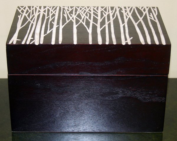 HAND PAINTED BIRCH BOX, H 7", W 11", D 7": HAND PAINTED BIRCH BOX, H 7", W 11", D 7":depicting white painted trees carved into the hinged lid; brown felt interior;