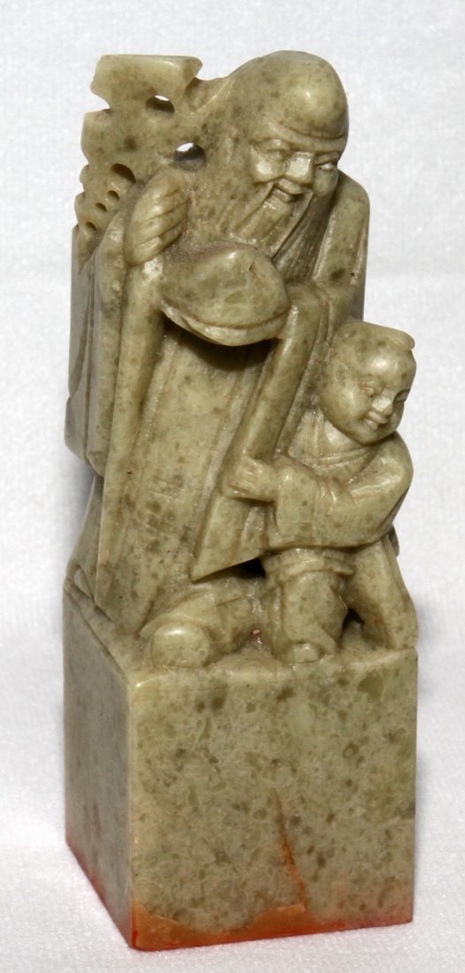 CHINESE SOAPSTONE STAMP, H 5": CHINESE SOAPSTONE STAMP, H 5":Depicting one of the Seven Lucky gods and child.