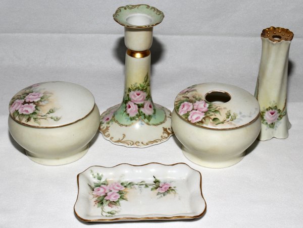 BAVARIAN PORCELAIN DRESSER SET, LATE 19TH C.: BAVARIAN PORCELAIN DRESSER SET, LATE 19TH CENTURY, FOUR, H 3" - 6":Including 2 jars, 1 hat pin holder (chipped) and 1 candlestick. Hand painted.