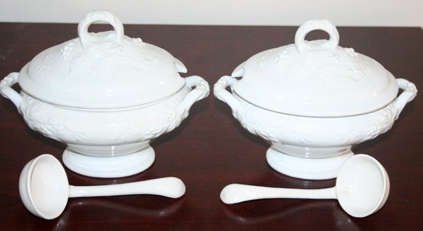 FENTON IRONSTONE TUREENS AND LADLES, 4 PCS.: FENTON IRONSTONE TUREENS AND LADLES, 4 PCS., H 6", W 8", D 5":two white tureens with lids with leaf and berry designs in relief, side handles and ring handle on lid; includes a ladle for each. Short p