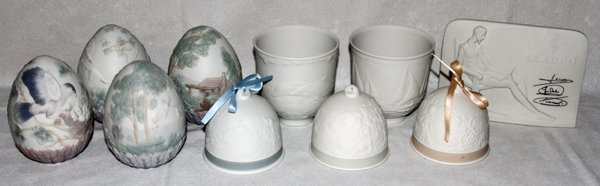LLADRO BISQUE BELLS, EGGS, PLAQUE, TEN PIECES,: LLADRO BISQUE BELLS, EGGS, PLAQUE, TEN PIECES, H 3 1/2"-4 1/2":Including 4 eggs, 3 bells, 2 cups, and 1 plaque. Measuring H.3 1/2"-4 1/2", titles include "Swan Family", "Horses in Flight", "Don Quixot
