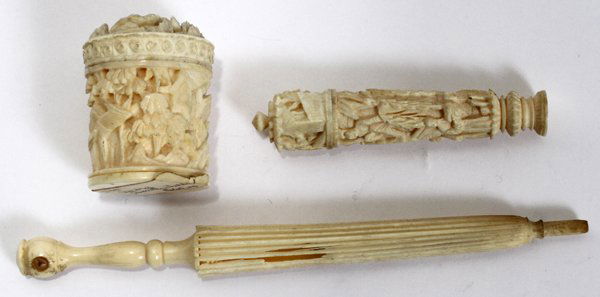 CHINESE IVORY NEEDLE CASES (2) & A THIMBLE CASE: CHINESE IVORY NEEDLE CASES (2) & A THIMBLE CASE, C. 1900, L 1 1/4"-4":Including 1 needle case carved as a parasol, L.4 1/4", and 1 needle case carved in low relief with figures, L.2 1/4", together wit