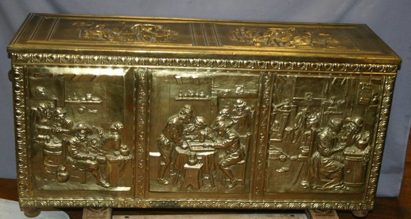 DUTCH BRASS CHEST, H 20", W 40", D 14": DUTCH BRASS CHEST, H 20", W 40", D 14":metal paneled sides and top with pub scenes in relief.