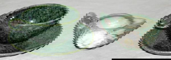 ROSEVILLE POTTERY CREAMER, CUP & SAUCER: ROSEVILLE POTTERY CREAMER, CUP AND SAUCER:Creamer 2". Green cup and saucer. Creamer #30. Cup and saucer [Raymor] deep mottled green.