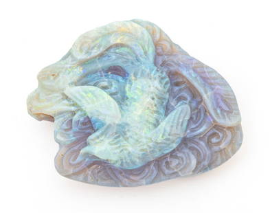 Opal Carving, Unmounted Depicting Phoenix in Flight, H 1.4" W 1.7" 17g: Opal Carving, Unmounted Depicting Phoenix in Flight, H 1.4" W 1.7" 17g | Opalescent with highlights in green, lavender ground. Total weight: 17 grams. Provenance: From the Estate of Prominent Collecto