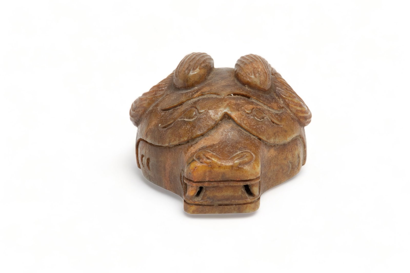 Carved Stone Wall Mount, Ram's Head, Ca. 1900, L 4.2": Carved Stone Wall Mount, Ram's Head, Ca. 1900, L 4.2" | Comprised of brown stone. Circa 1900. Provenance: From the Estate of Prominent Collector, Leon Zielinski, Macomb County, MI