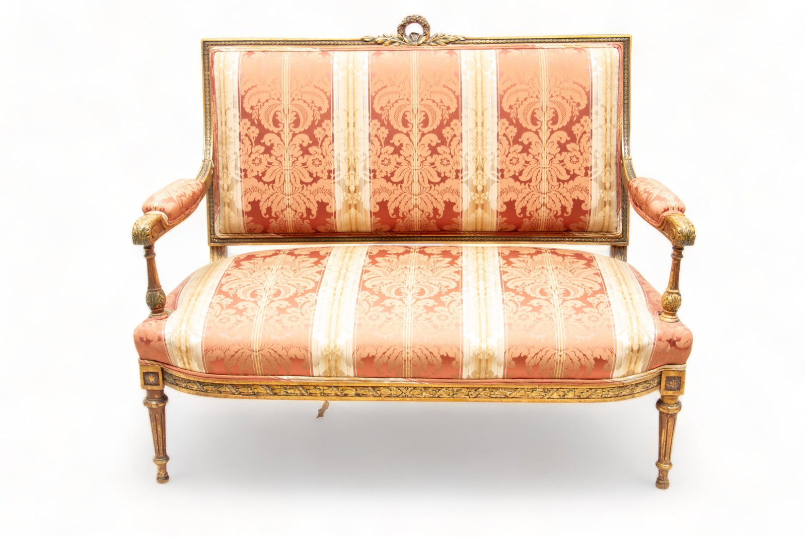 Louis XVI Style Upholstered Gilded Wood Sofa, H 40" L 43" Depth 24": Louis XVI Style Upholstered Gilded Wood Sofa, H 40" L 43" Depth 24" | the backrest offers a central wreath with leaf and berry motifs. Offers red and cream striped and patterned upholstery. Terminatin
