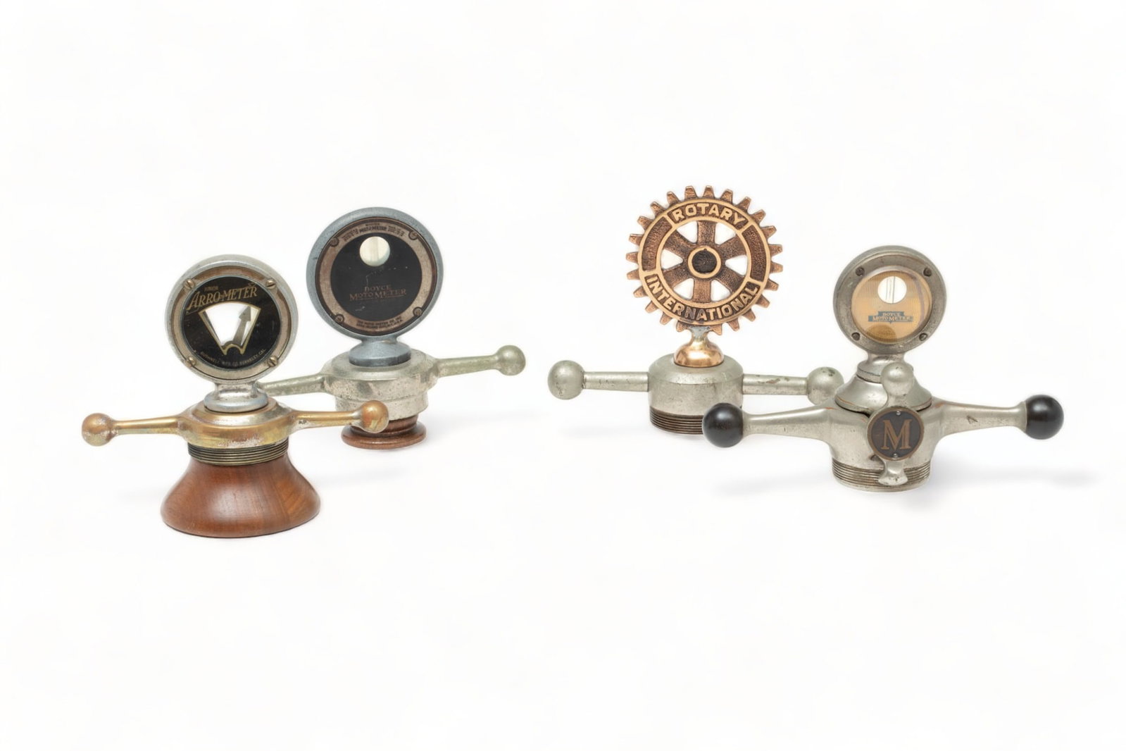 Boyce Motometers, Arro-Meter And One Motor Mascot Ca. Early to Mid 20th C., 4 pcs: Boyce Motometers, Arro-Meter And One Motor Mascot Ca. Early to Mid 20th C., 4 pcs | Lot includes one Junior Boyce Motometer mounted to a dog bone cap with an 'M' medallion. H 5", W 7", D 3". One Junio