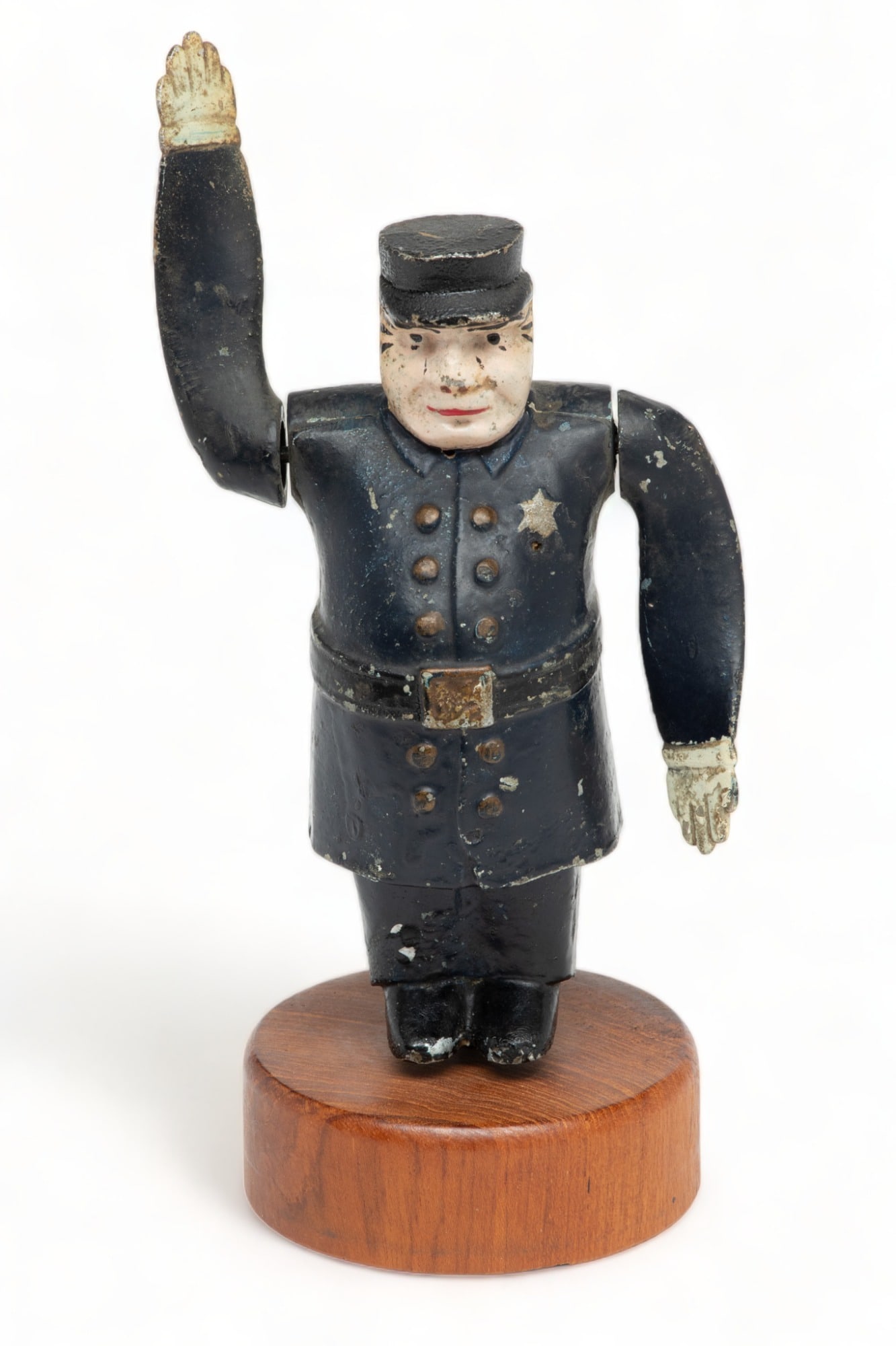 American Policeman Whirligig Motor Mascot, Ca. 1920s, H 7.5" W 4.5" Depth 2.5": American Policeman Whirligig Motor Mascot, Ca. 1920s, H 7.5" W 4.5" Depth 2.5" | Painted aluminum motor mascot in the form of a police officer. Arms designed to spin as the vehicle moves. Marked on th