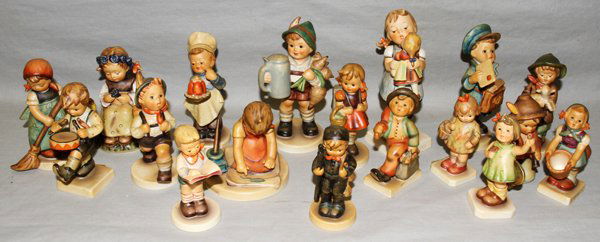 HUMMEL FIGURINES & ORNAMENT, 19 PIECES: HUMMEL FIGURINES & ORNAMENT, 19 PIECES:Including "School Boy", HN82; "School Girl", HN81; "I Brought You a Gift", HN479; "Little Drummer", HN240; "Little Tooter", HN214; "Kiss Me", HN311l "Merry Wande