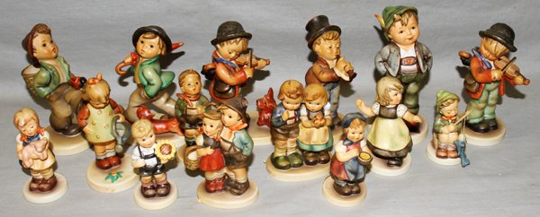 HUMMEL FIGURINES, 15 PIECES: HUMMEL FIGURINES, 15 PIECES:Including "Pigtails", Hn2052; "From Me to You", Hn629; "A Big Fish", Hn907; "Sunflower Boy", Hn2219; "Little Fiddler", Hn210; "Puppy Love", Hn1; "Serenade", Hn85; "Hello Wo