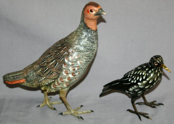 AUSTRIAN, COLD PAINTED, BRONZE BIRD SCULPTURES: AUSTRIAN, COLD PAINTED, BRONZE BIRD SCULPTURES, 2 PCS., 5" & 9" H, QUAIL AND BLACKBIRD:one of a quail with blue, brown tone painted feathers, 9" H. x 7" L. one white European Starling, 5" H. x 5" L.