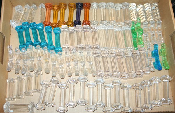 VAL ST. LAMBERT GLASS KNIFE RESTS, APPROX.: VAL ST. LAMBERT GLASS KNIFE RESTS, APPROX. 75 PCS., L 4" - 5":Clear and colored glass. Approx. 70 pcs. Box lot.