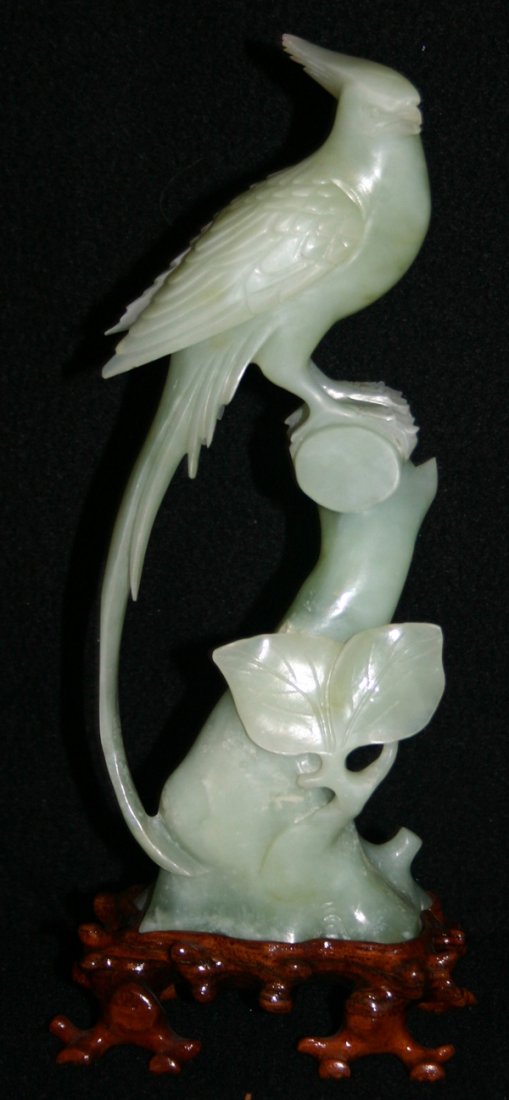 CHINESE CARVED SOAPSTONE FIGURE OF A PHEASANT: CHINESE CARVED SOAPSTONE FIGURE OF A PHEASANT, H 9", L 3":Chinese carved soapstone figure of a pheasant on a carved wood stand, H 9" x L 3 1/2"