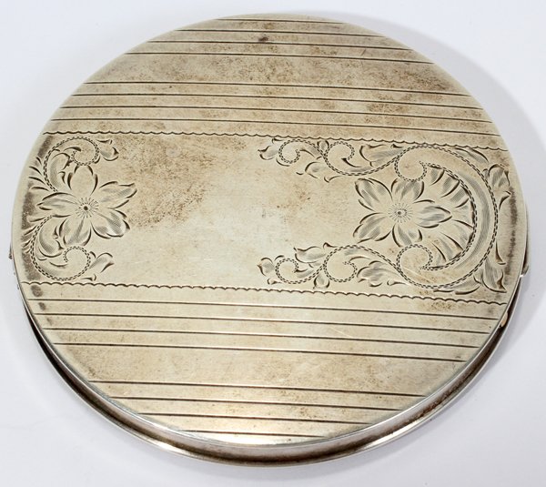 REX STERLING SILVER COMPACT, C. 1940, DIA 4": REX STERLING SILVER COMPACT, C. 1940, DIA 4":Stamped "Sterling" at one side (see second photo) and includes a "Sterling Silver Rex" label at the interior.