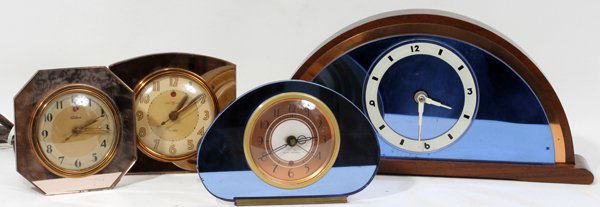 ART DECO MANTEL & BOUDOIR CLOCKS, FOUR, H 5"-7": ART DECO MANTEL & BOUDOIR CLOCKS, FOUR, H 5"-7", W 5"-14":Including 1 Sessions mantel clock, walnut and glass, H.6 3/4", W.14", and 3 mirrored, electric boudoir clocks with alarms, by Seth Thomas, Tel