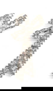 Platinum And Diamond Bowknot Brooch, Ca. 1920, H 2" W 1" 16g: Platinum And Diamond Bowknot Brooch, Ca. 1920, H 2" W 1" 16g | 1.65ct center European cut diamond accented by 51 round cut prong set diamonds. Bowknot form. Total weight: 16 grams. Provenance: