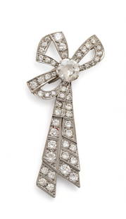 Platinum And Diamond Bowknot Brooch, Ca. 1920, H 2" W 1" 16g: Platinum And Diamond Bowknot Brooch, Ca. 1920, H 2" W 1" 16g | 1.65ct center European cut diamond accented by 51 round cut prong set diamonds. Bowknot form. Total weight: 16 grams. Provenance: