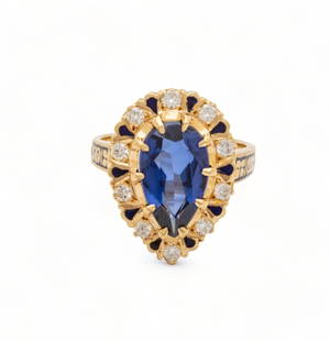 Pear-Shaped Synthetic Sapphire, Diamond & 18kt Gold Ring, Size: 6.5, 7g: Pear-Shaped Synthetic Sapphire, Diamond & 18kt Gold Ring, Size: 6.5, 7g | Central pear-shaped synthetic sapphire encircled by 10 round cut melee diamonds .30ct VS-H. Marked "14k" on interior of