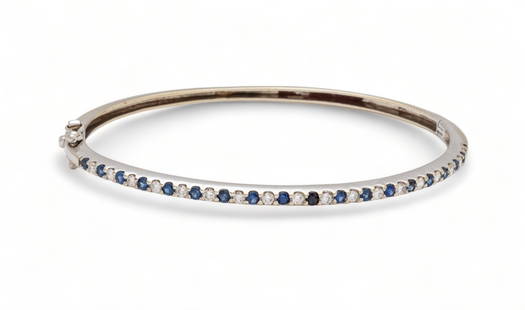 14kt White Gold, Diamond & Sapphire Bangle Bracelet, Dia. 2.25" 9g: 14kt White Gold, Diamond & Sapphire Bangle Bracelet, Dia. 2.25" 9g | the bracelet offers alternating diamond and sapphire stones. Total weight: 9 grams. Provenance: Property of a Rochester Hills, MI p