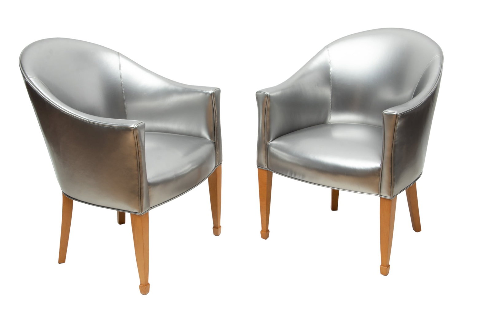 Pair of Jean Michel Frank (French) Silver-Toned Upholstered Arm Chairs, H 32.5" W 24" Depth 26": Pair of Jean Michel Frank (French) Silver-Toned Upholstered Arm Chairs, H 32.5" W 24" Depth 26" | Silver-tone vinyl upholstery with tapered carved wood legs. Provenance: From the Collection of Bethany