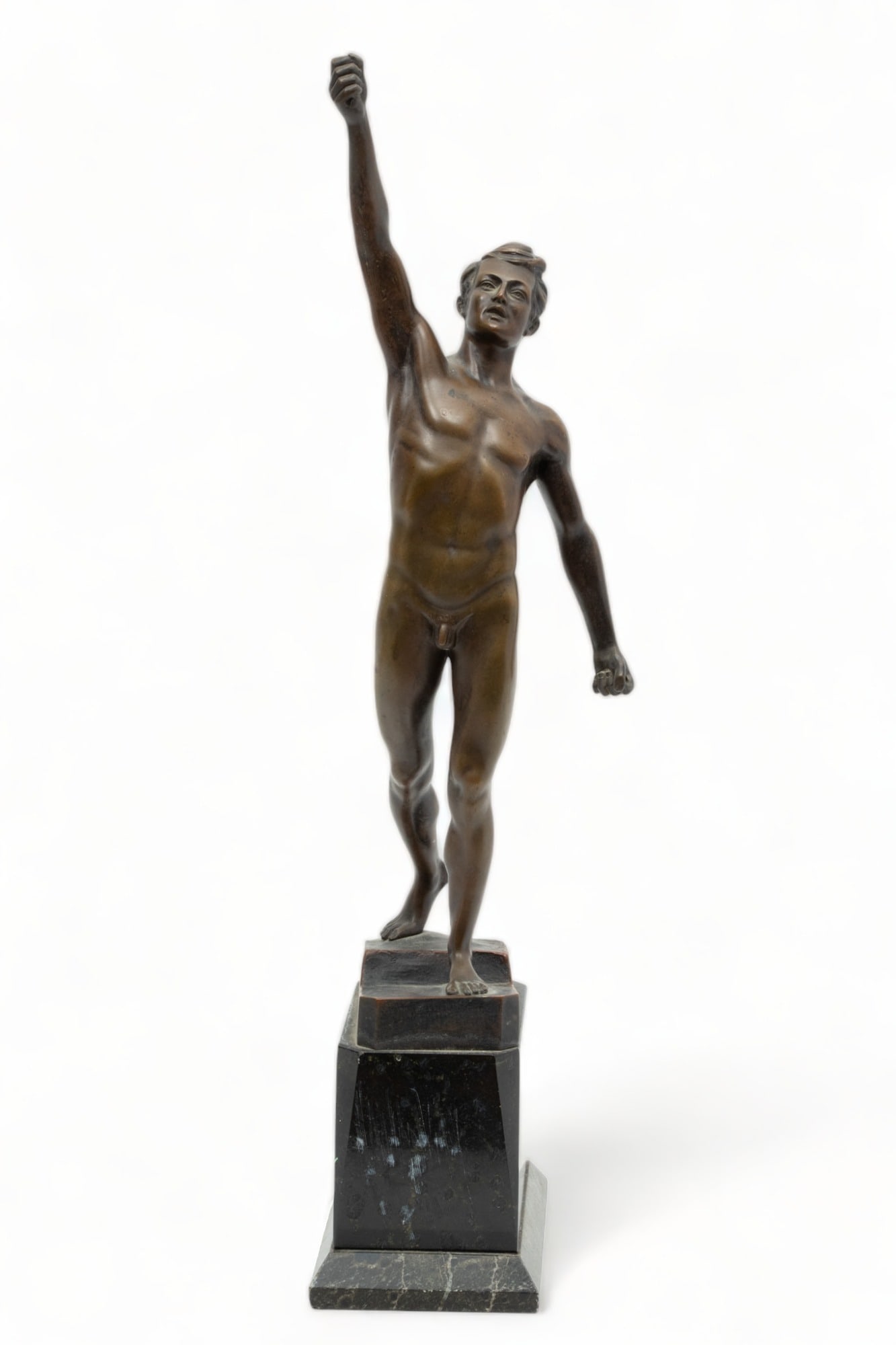 Otto Schmidt-Hofer (German, 1873-1925) Bronze Sculpture, "Olympian", H 16" W 3" L 5": Otto Schmidt-Hofer (German, 1873-1925) Bronze Sculpture, "Olympian", H 16" W 3" L 5" | Depicting a nude male with arm raised. Signed to the base. Presented on the original dual-marble pedestal, measur