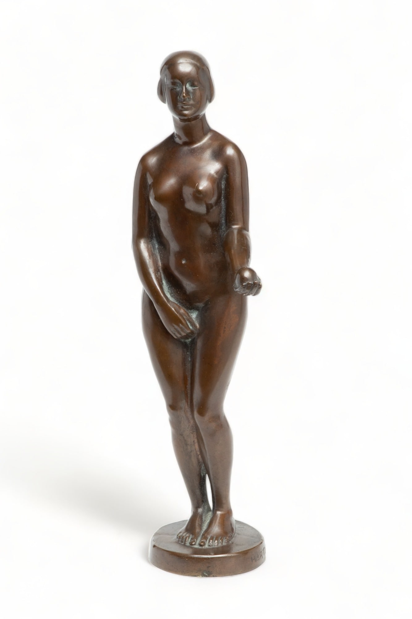A. Hartl , Bronze Sculpture, Ca. 1930, "Eve with Apple,", H 11" W 4" Depth 3.5": A. Hartl , Bronze Sculpture, Ca. 1930, "Eve with Apple,", H 11" W 4" Depth 3.5" | Depicting nude standing Eve with an outstretched arm with an apple. Signed 'HARTL A.' to the base. Provenance: Propert