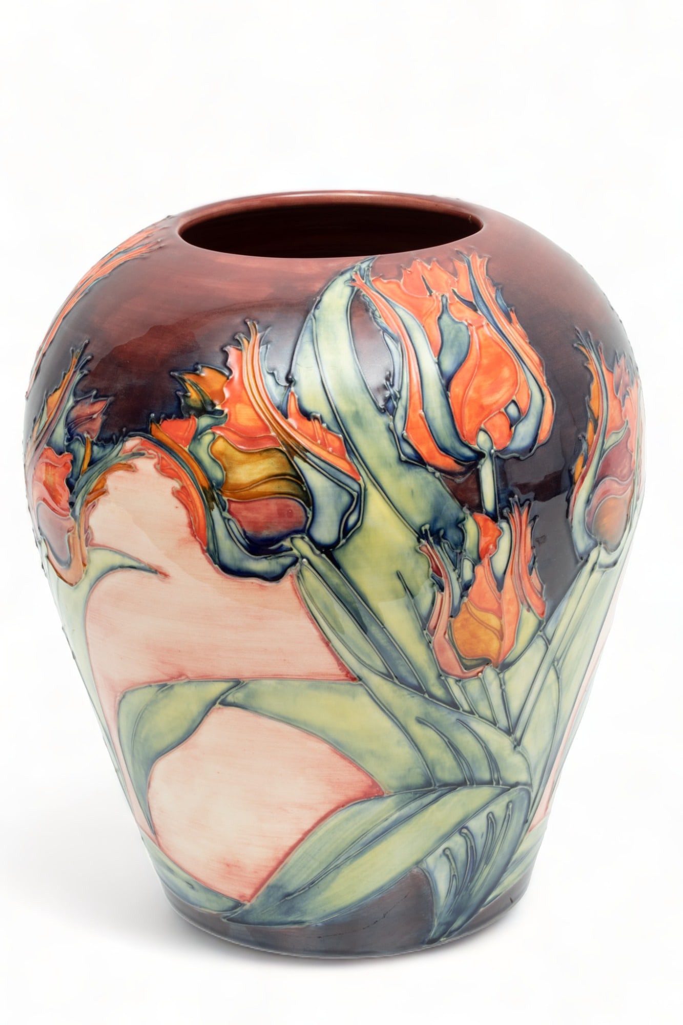 William Moorcraft (England) Tulip Pattern Earthenware Vase, H 12" Dia. 10": William Moorcraft (England) Tulip Pattern Earthenware Vase, H 12" Dia. 10" | the vase offers rounded shoulders and a tapering form. Offers a polychrome glaze rendering a tulip pattern. Bearing signatu