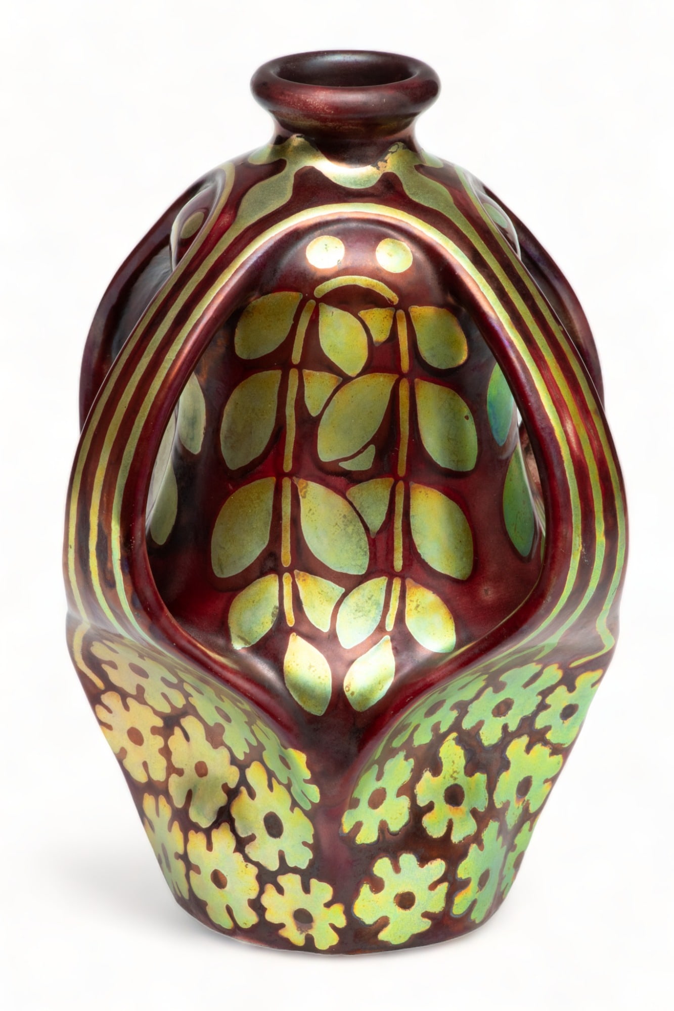 Zsolnay (Hungary) Art Pottery, Three-handled Vase, H 8.5" Dia. 7.5": Zsolnay (Hungary) Art Pottery, Three-handled Vase, H 8.5" Dia. 7.5" | Red ground with iridescent gold design of lower and leaves. Pinched base rising to four handles. Marked on underside with Zsolnay