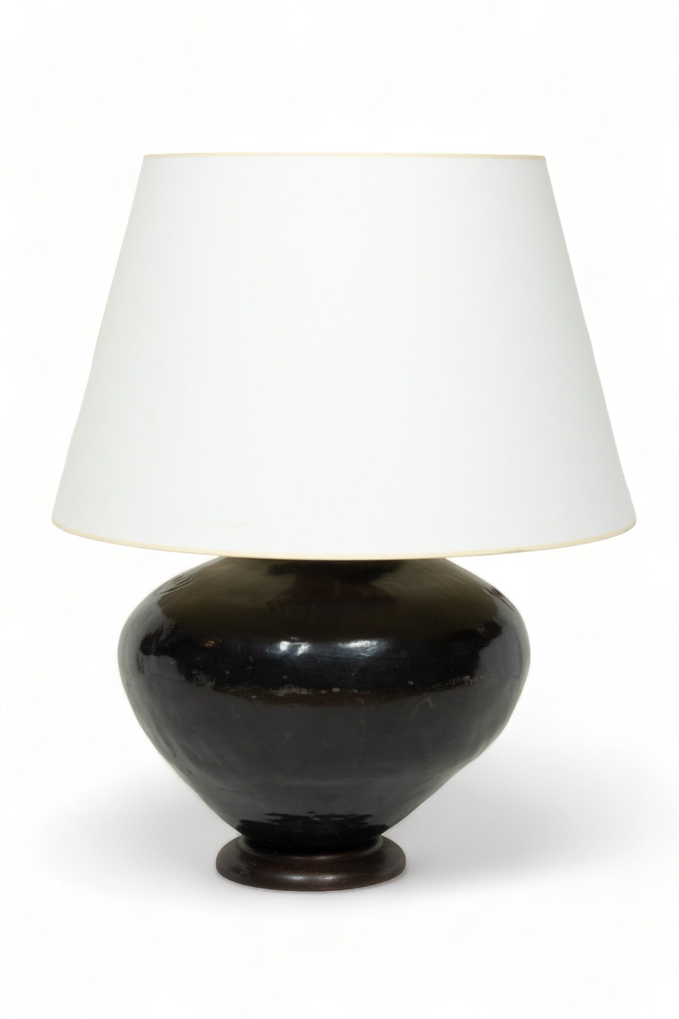 Earthenware Vessel, Mounted As Lamp, H 28" Dia. 16": Earthenware Vessel, Mounted As Lamp, H 28" Dia. 16" | the lamp offers a single light socket on a black earthenware vessel base, featuring repetitious handprint form motifs to the shoulder. Electrified