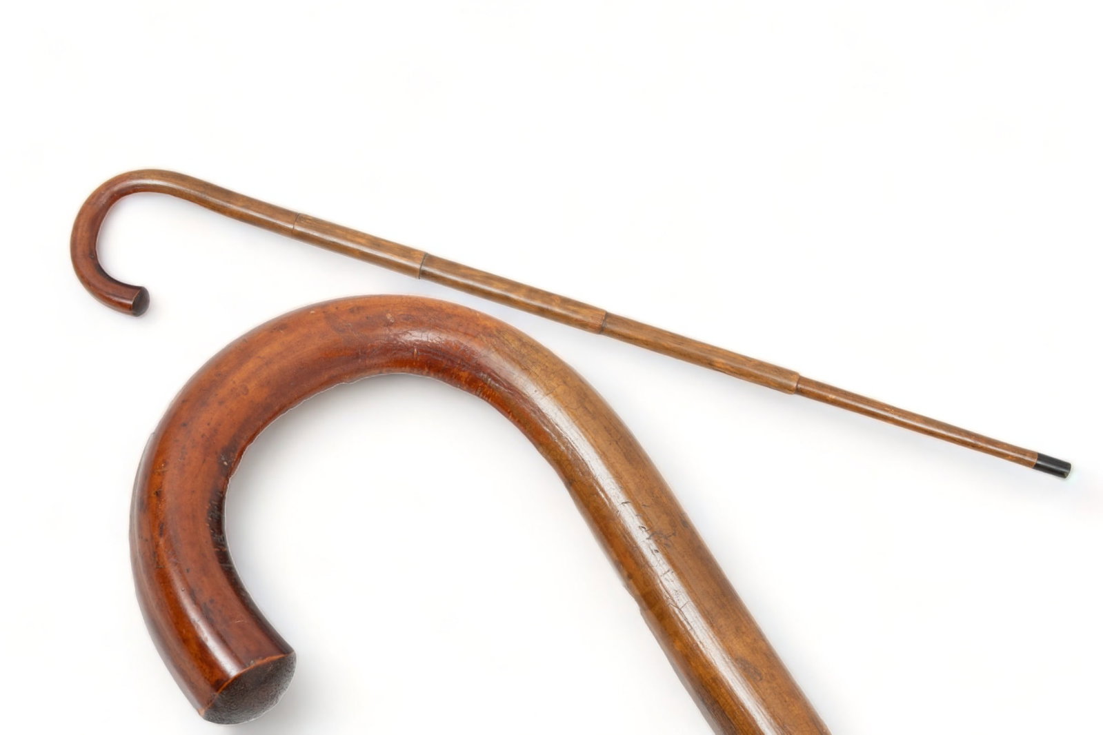Antique Carved Wood Cigar-Smoker's System Walking Stick, L 35.5": Antique Carved Wood Cigar-Smoker's System Walking Stick, L 35.5" | Having a hollow shaft with a built-in lighter in the upper center that is exposed when the shaft is pulled in both directions. the lo