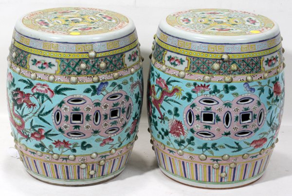 CHINESE PORCELAIN GARDEN STOOLS, PAIR, H 12": CHINESE PORCELAIN GARDEN STOOLS, PAIR, H 12", DIA 10":Pair of Chinese porcelain garden stools H 12 1/2" x dia 10". Having a flower and dragon motif on a blue ground with pink, yellow, and green accent