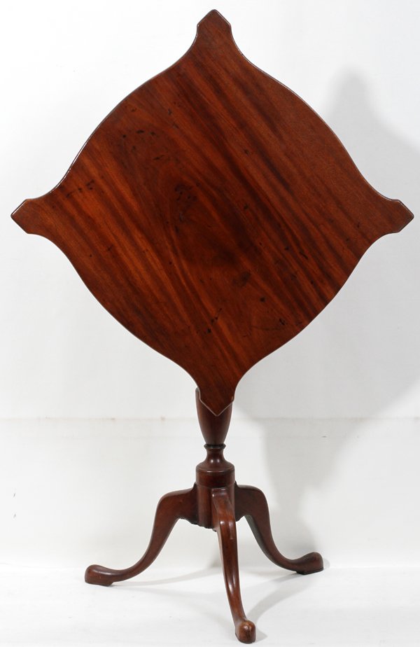 AMERICAN MAHOGANY TILT-TOP TABLE H 29", DIA 30": AMERICAN MAHOGANY TILT-TOP TABLE, H 29", DIA 30":Featuring a shaped rectangular top.