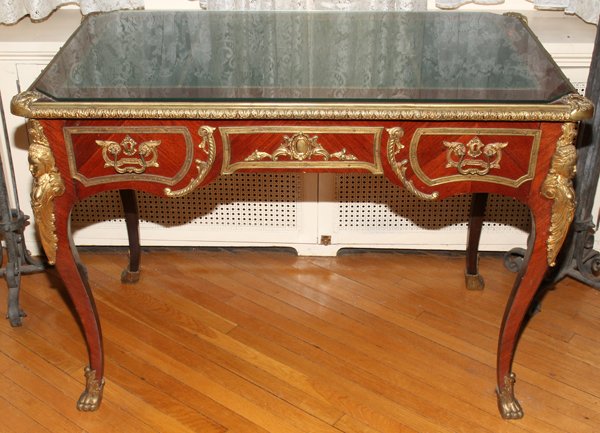 MAHOGANY & BRONZE ORMOLU WRITING DESK, H 30",: FRENCH EMPIRE STYLE MAHOGANY & BRONZE ORMOLU WRITING DESK, H 30", W 41", D 25":Having a single drawer that is a three drawer façade and a faux drawer on the other side. With a glass top.