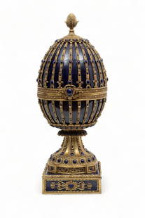 Porcelain And Metal Egg-Formed Hinged Box, H 24" W 7.75" L 7.75": Porcelain And Metal Egg-Formed Hinged Box, H 24" W 7.75" L 7.75" | Acorn finial, Empire style egg formed box on a pedestal support.