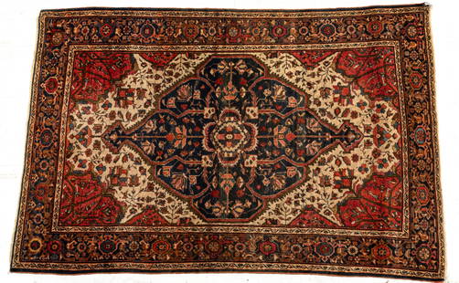 Persian Sarouk Hand Woven Wool Oriental Rug Ca. 1920, W 34" L 60": Persian Sarouk Hand Woven Wool Oriental Rug Ca. 1920, W 34" L 60" | Ivory center ground with center geometric medallion. Oxblood ground and blue border. Provenance: Property from the collection of