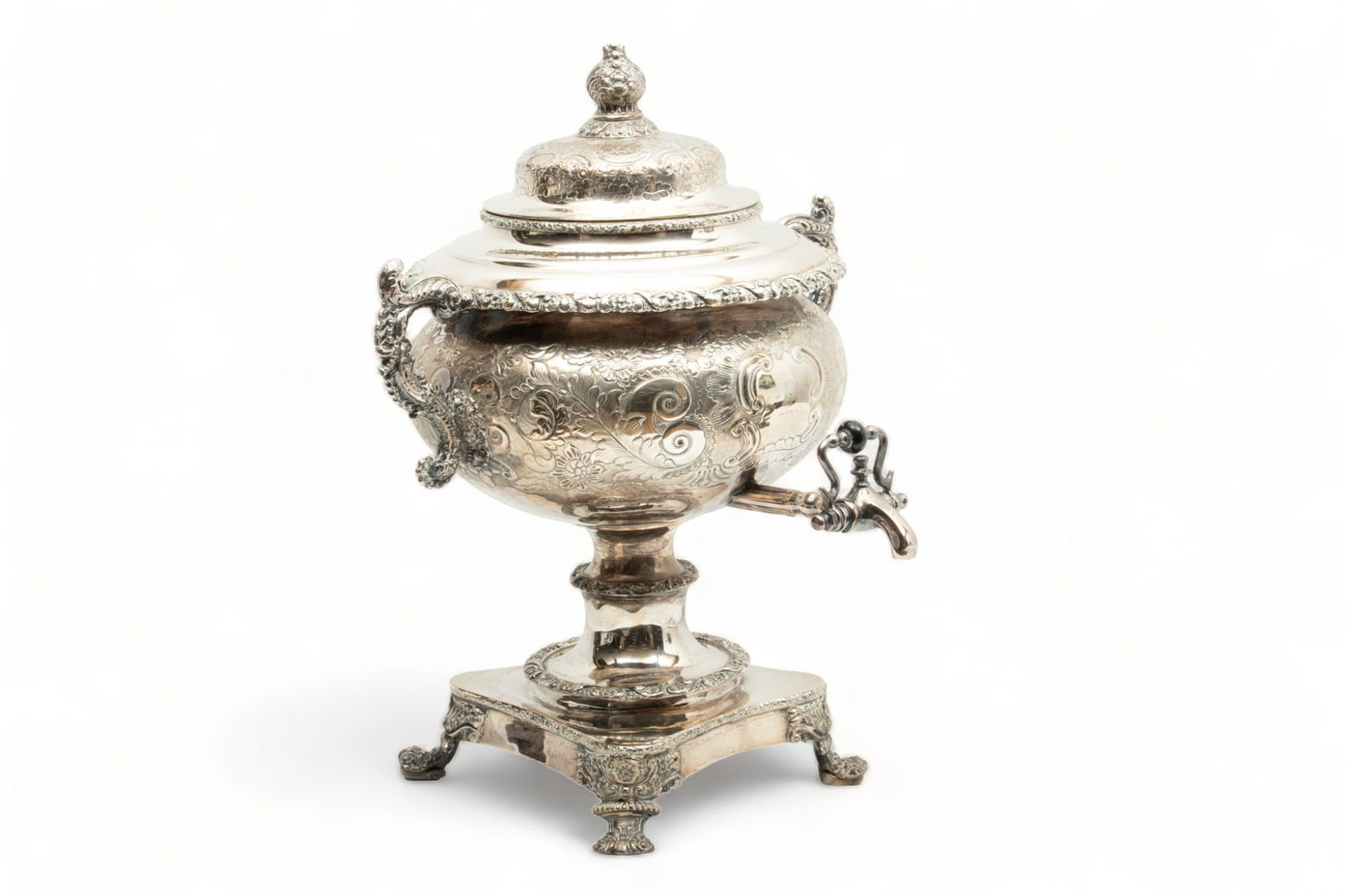 English Sheffield Silverplate Hot Water Kettle C 1870 H 16 1/2" L 14": English Sheffield Silverplate Hot Water Kettle C 1870 H 16 1/2" L 14" | Double Handles, Hand Chased Scroll, Floral And Leaf Designs, Ebony Insulator Knob Above Spigot, on Scroll Feet. Silver on Copper