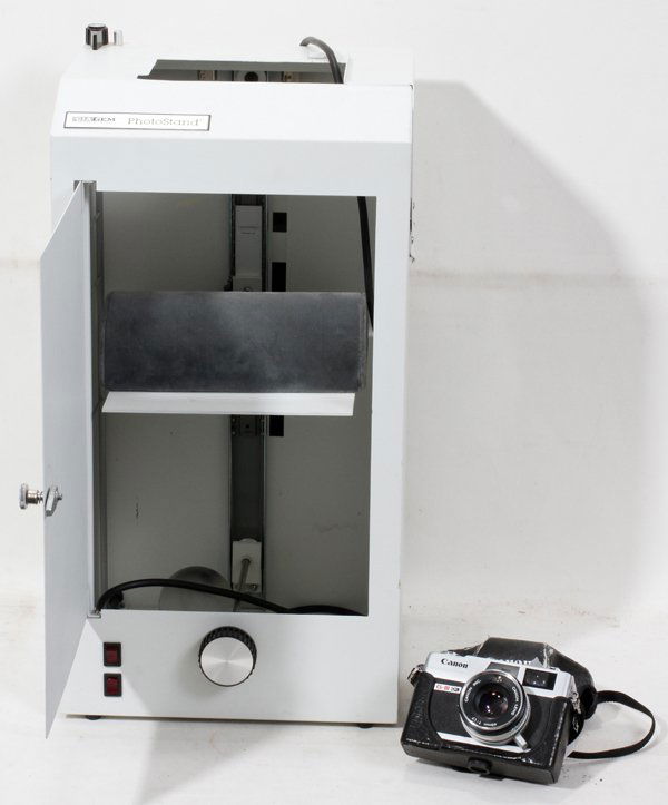 GIA GEM INSTRUMENT & COIN PHOTO STAND CABINET: GIA GEM INSTRUMENT JEWELRY & COIN PHOTO STAND CABINET BLACK LEATHER CARRYCASE, 35MM CANON CAMERA, H:Model # 740. Gia Gem instrument Jewery Photo-stand Baked White Enamel Cabinet metal. Size:21" x 11 1